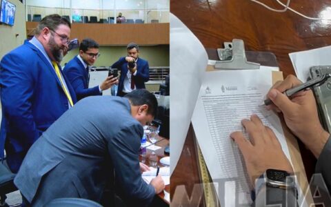 caio-andre-assina-documento-e-